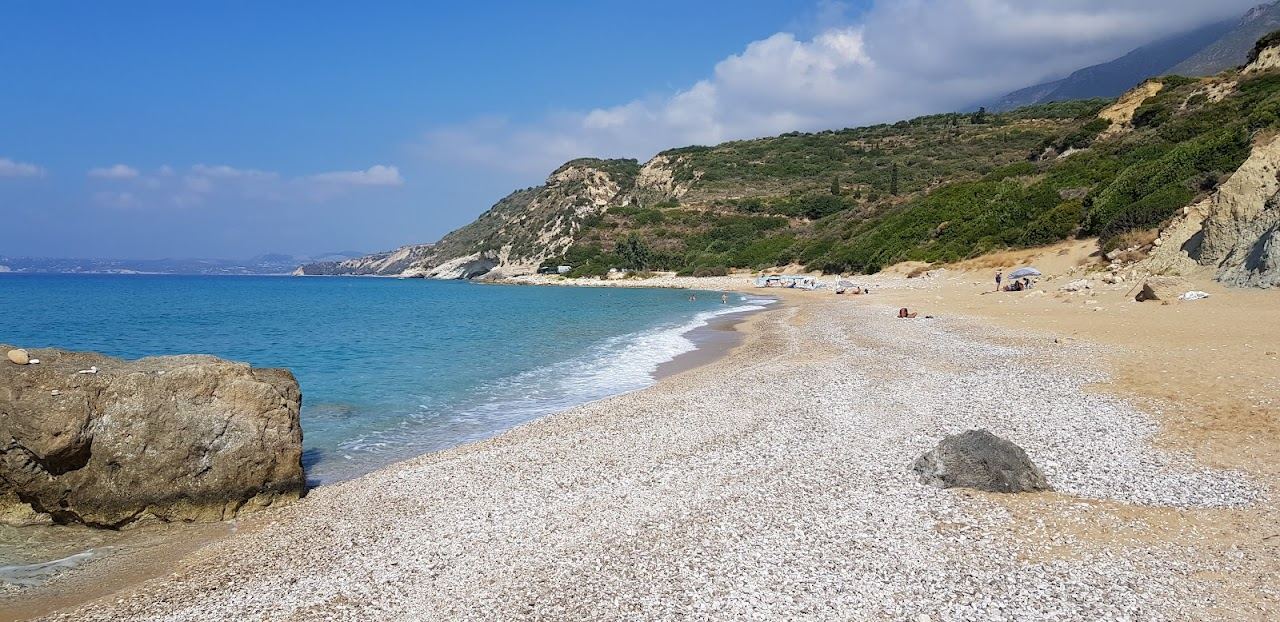 The long sand and shingle beach and clear water at Skala in southeast Kefalonia