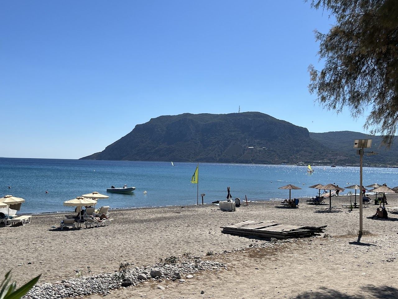 The long golden sand and clear water of Kefalos Beach in Kos, Greece