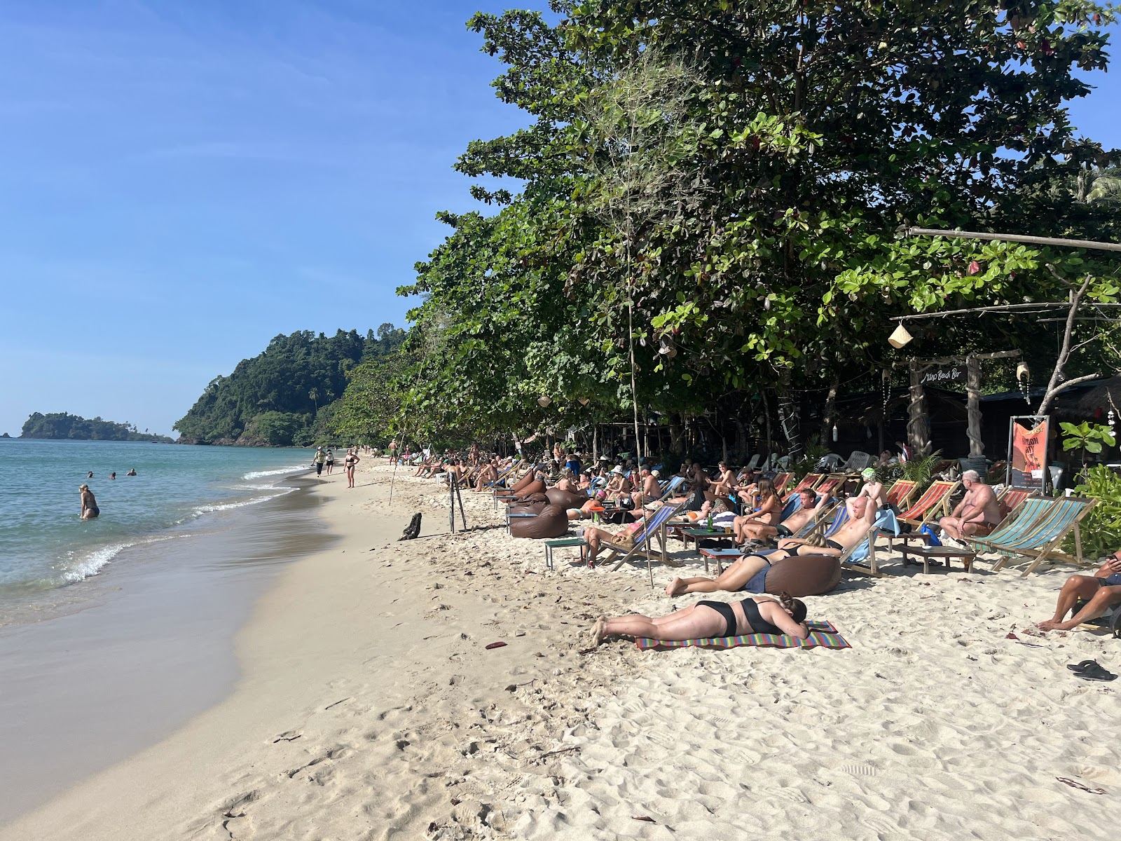 Palm backed sand and warm shallow water on the cheap west coast of Koh Chang