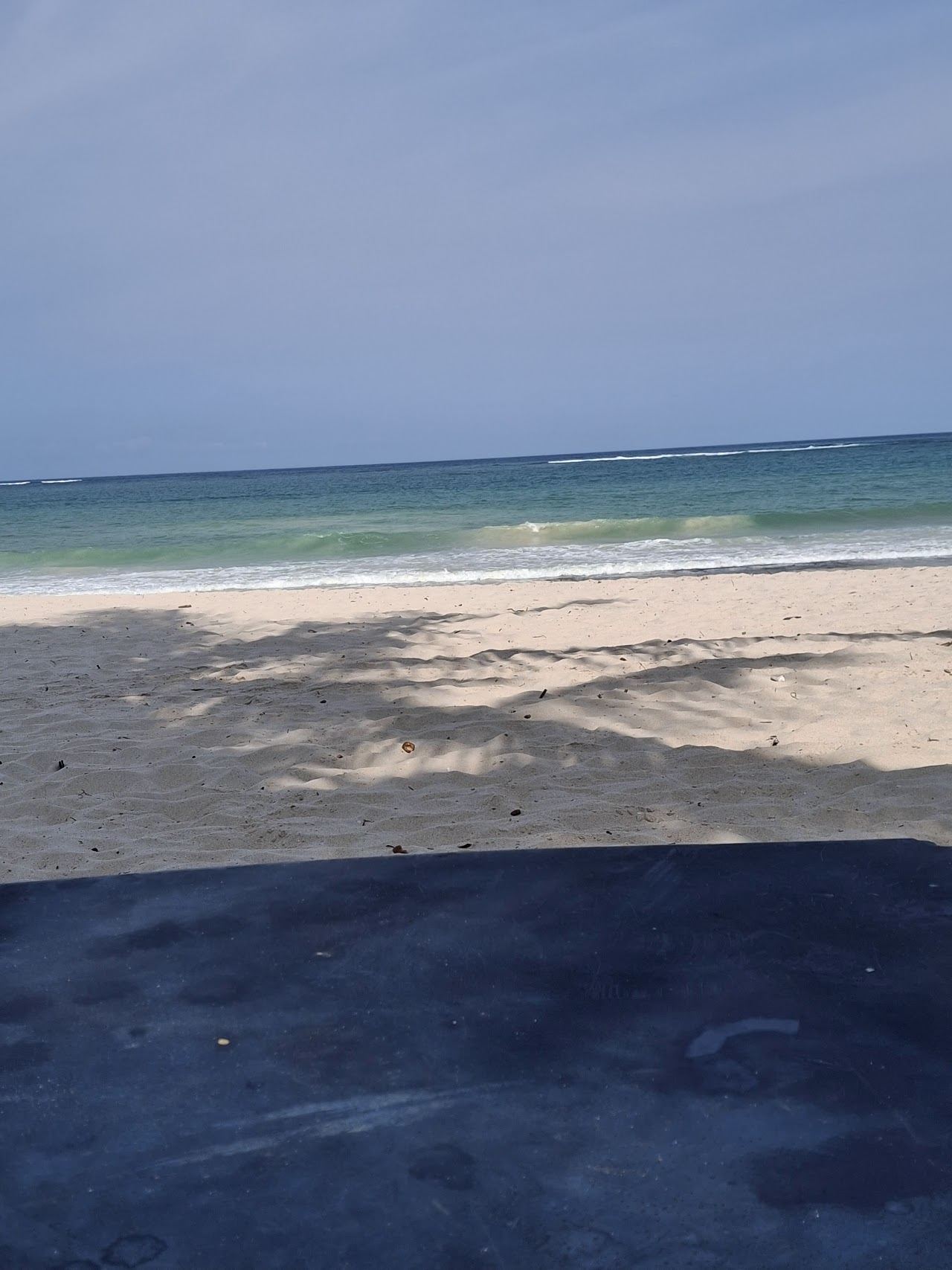 The white sand and estuary of Kongo Beach where the Kongo River meets the sea at Diani