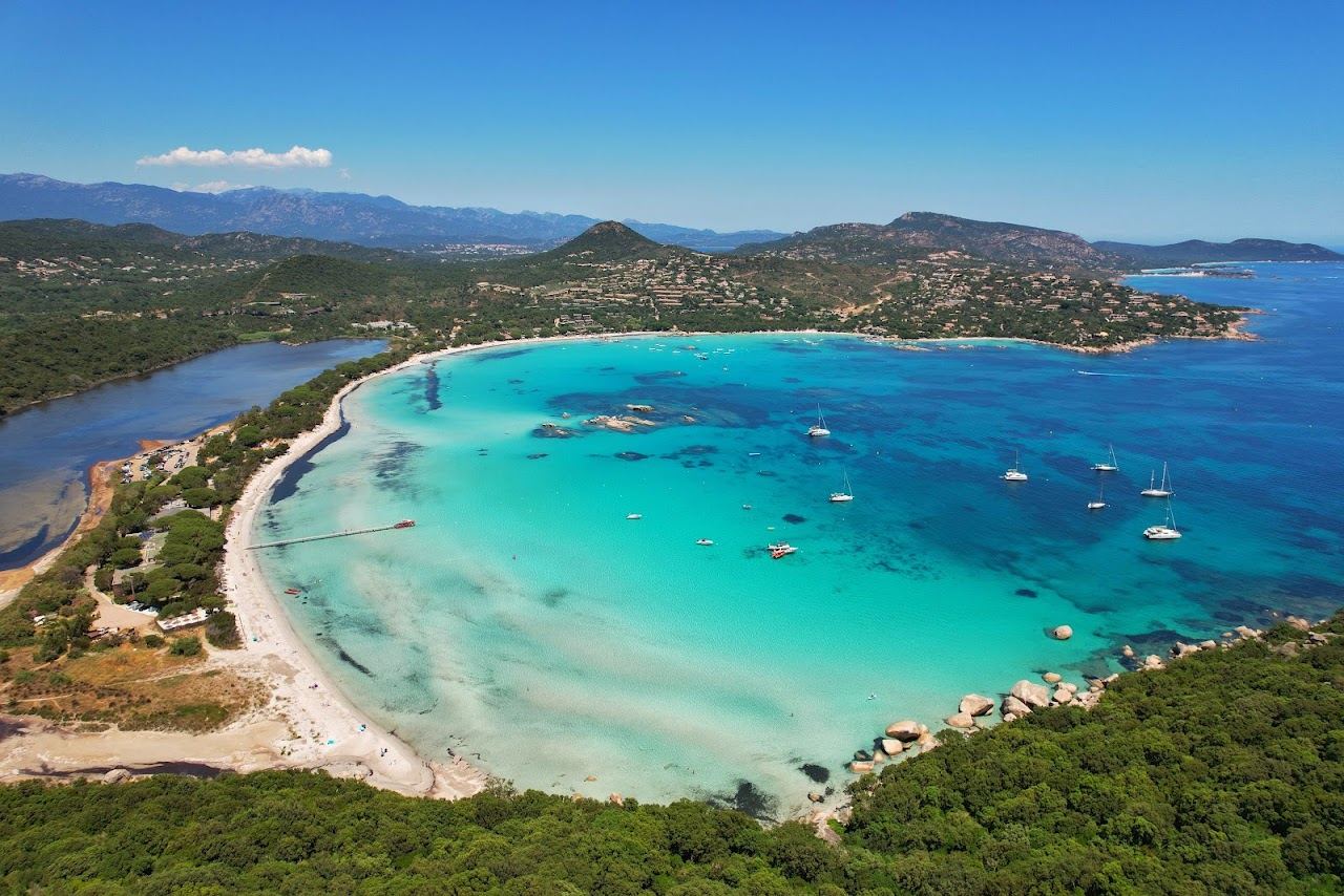 The shallow turquoise horseshoe bay of Santa Giulia beach in southern Corsica