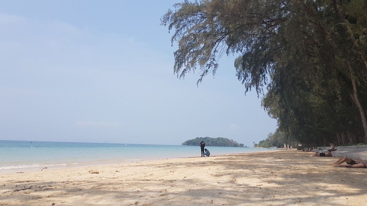 Calm, sheltered water and quiet sand backed by forest at Klong Muang beach in Krabi