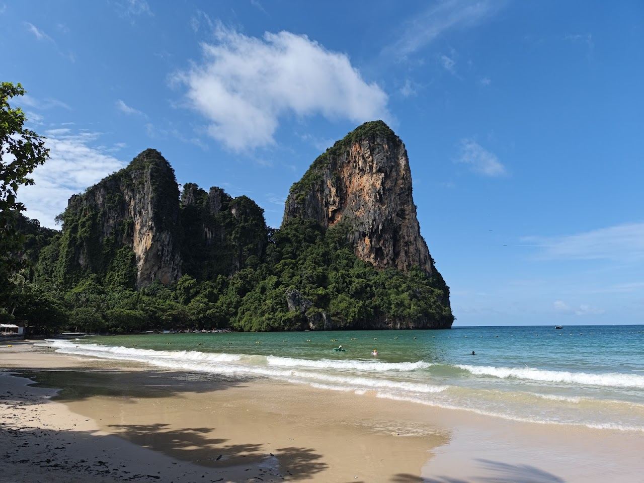 Soft white sand and limestone cliffs at Railay West in Krabi