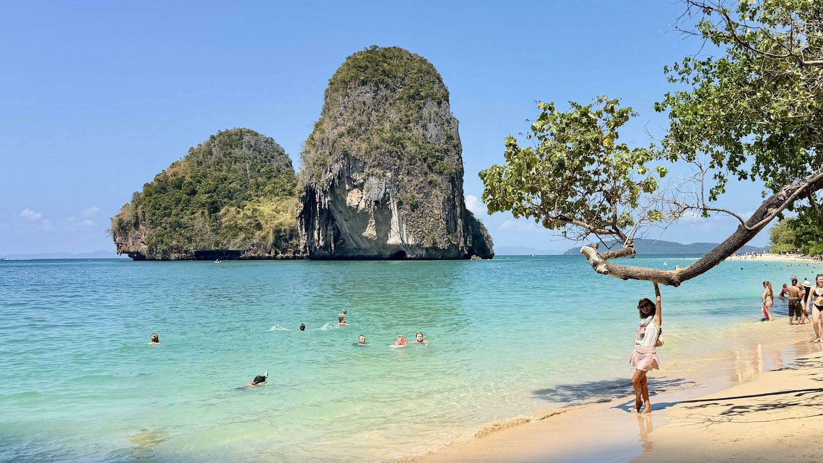 Powder white sand and jade water beneath the limestone cliffs of the Railay peninsula in Krabi