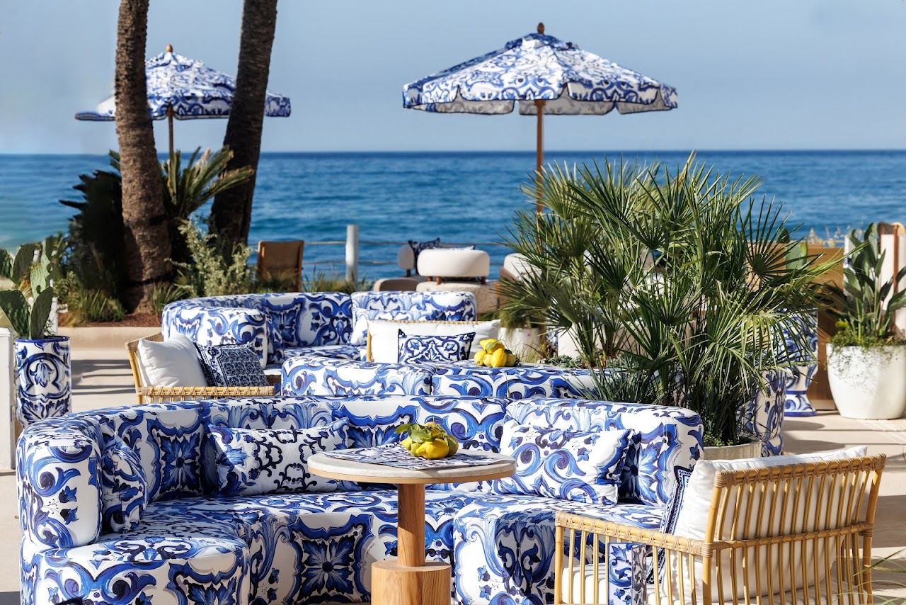 Pool, Balinese beds and sea view at La Cabane beach club on the Los Monteros shore near Marbella