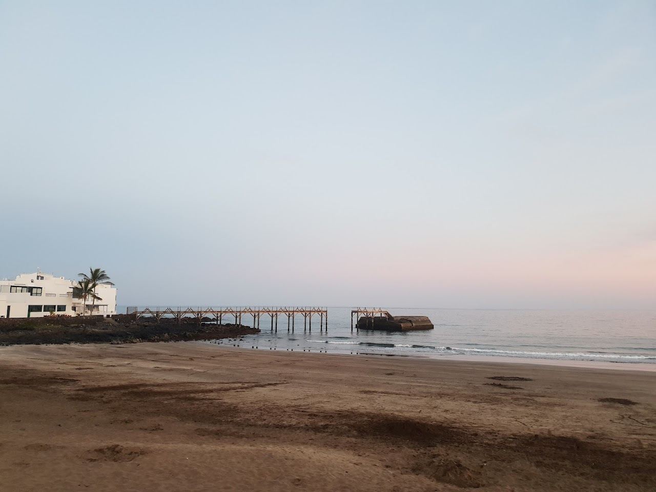 Calm golden family bay and sheltered water at Playa de la Garita in Arrieta, northeast Lanzarote
