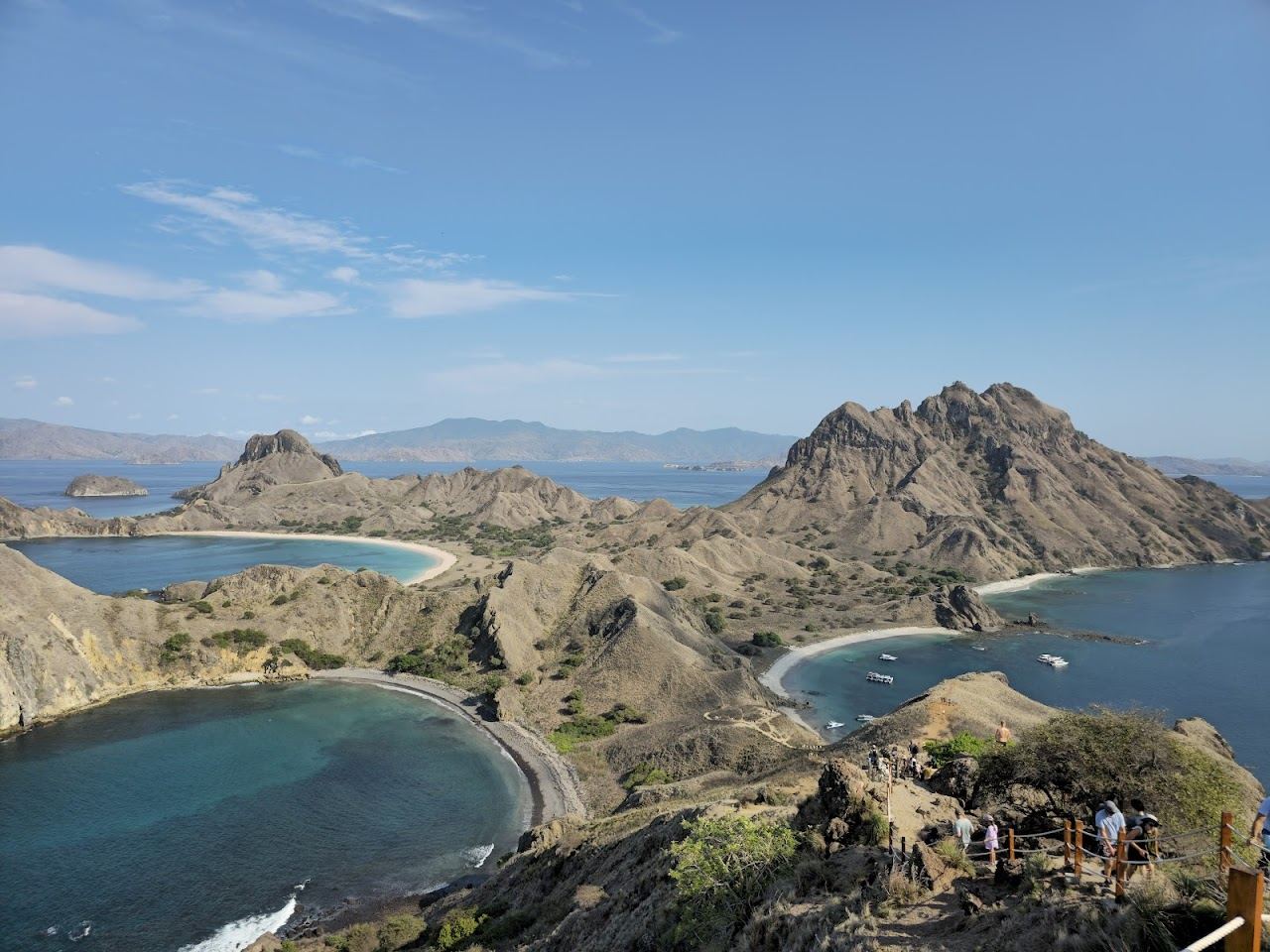 Layered island bays and blue water seen from the Padar viewpoint near Labuan Bajo