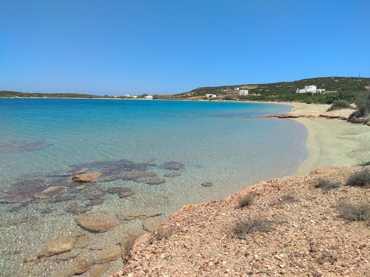 The wide golden sand, low dunes and clear water of Lageri beach between Naoussa and Santa Maria on Paros
