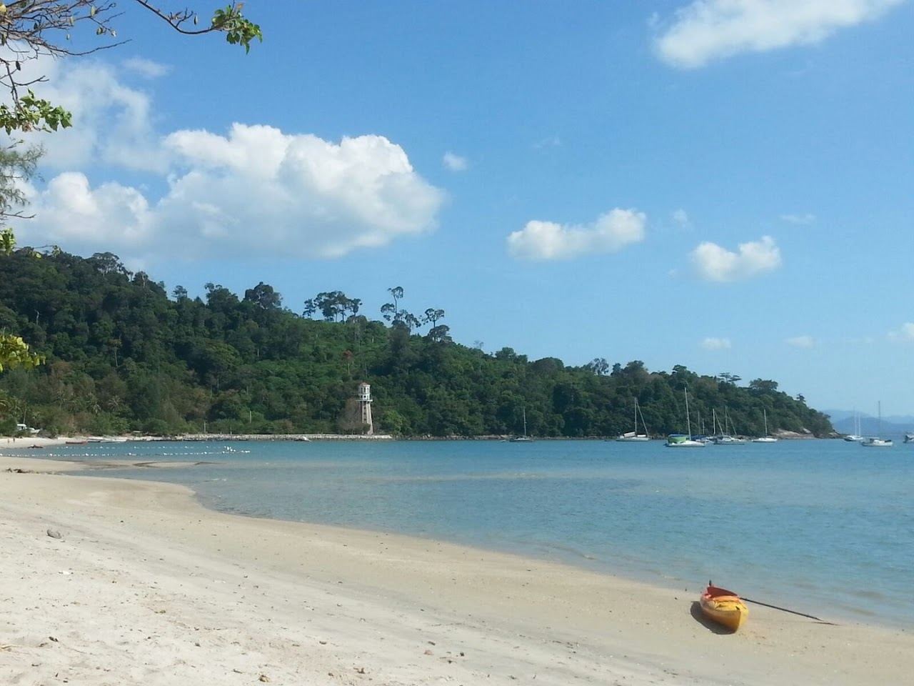 Quiet pale sand and calm Andaman Sea on the wooded Pantai Kok coast of west Langkawi where Tanjung Sanctuary sits