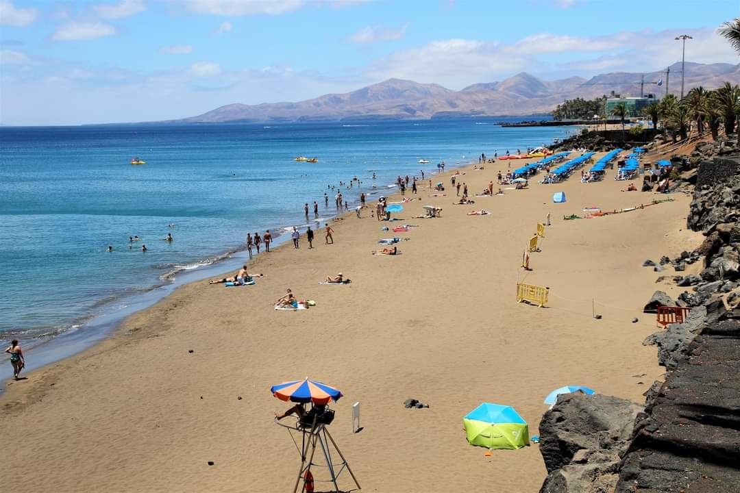 Golden beach and promenade at Puerto del Carmen in Lanzarote