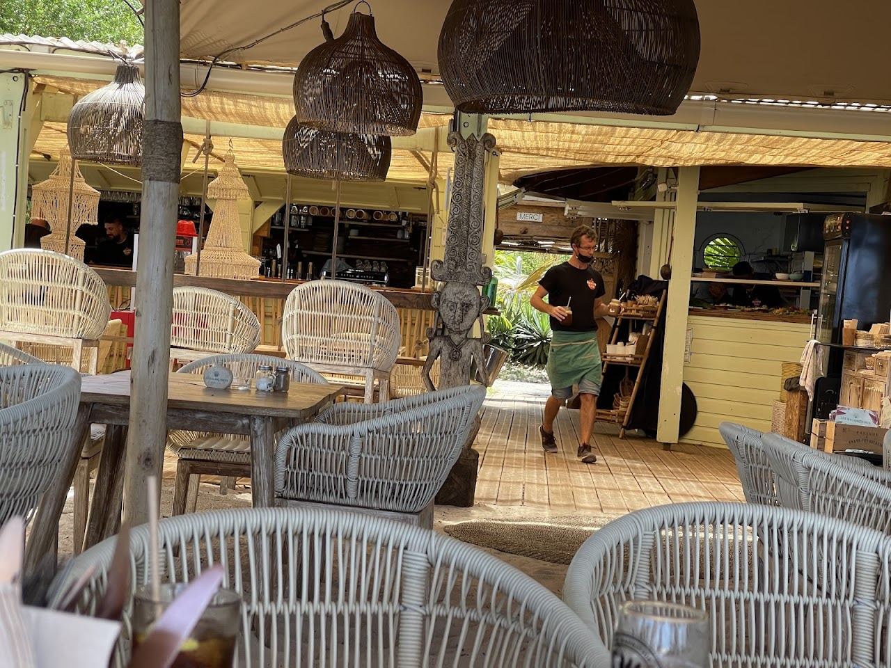 A lagoon side beach restaurant table under the filao pines at L'Hermitage beach in Reunion