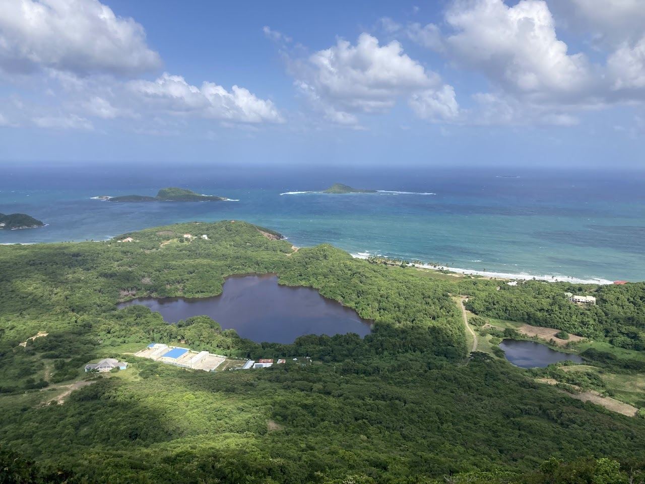 Sugar Loaf island rising offshore beyond the wild sand and sea grape of Levera Beach in northern Grenada