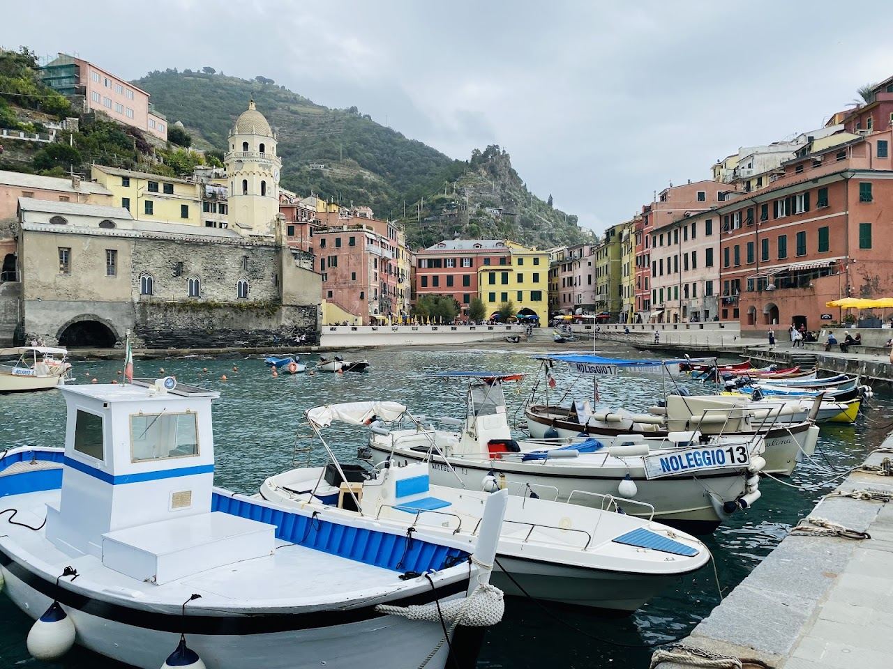 The harbour and pastel houses of a Cinque Terre village on the Liguria coast used for the when to go guide