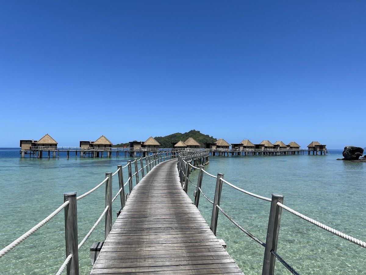 Overwater bures above the calm lagoon at Likuliku Lagoon Resort on Malolo Island in Fiji