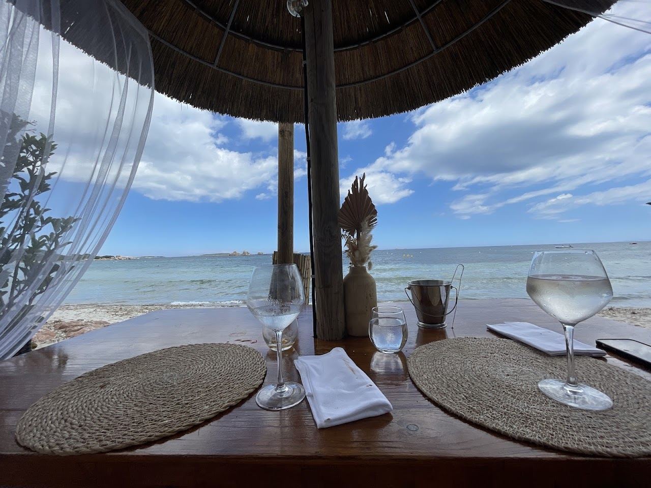 Sunbeds and parasols at Linda Beach Lounge on the white sand of Palombaggia in south Corsica