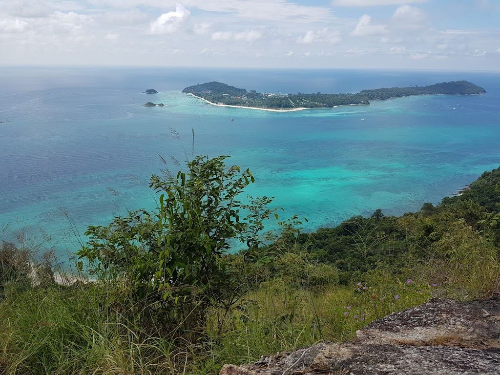 Jungle covered Koh Adang seen across the water from Sunset Beach on Koh Lipe
