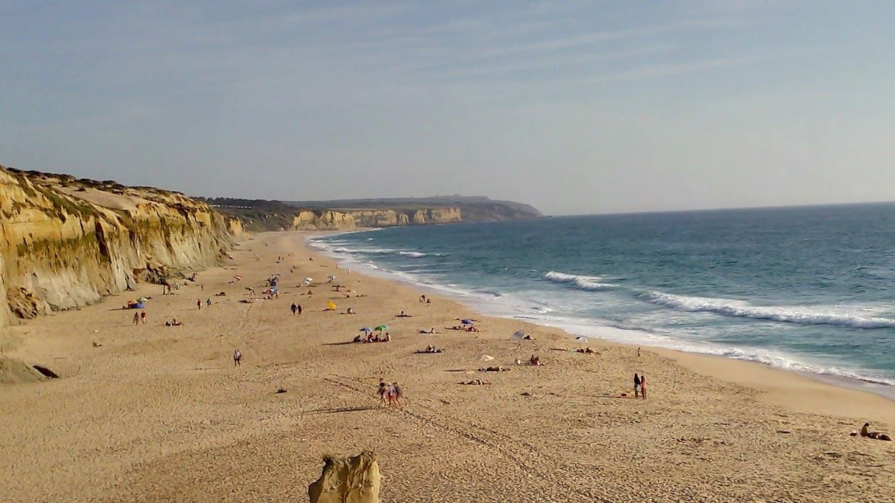The wild dune backed sand and cliffs of Praia do Meco near Sesimbra