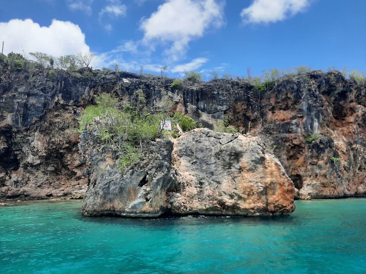 The tiny cliff backed snorkel cove of Little Bay in Anguilla