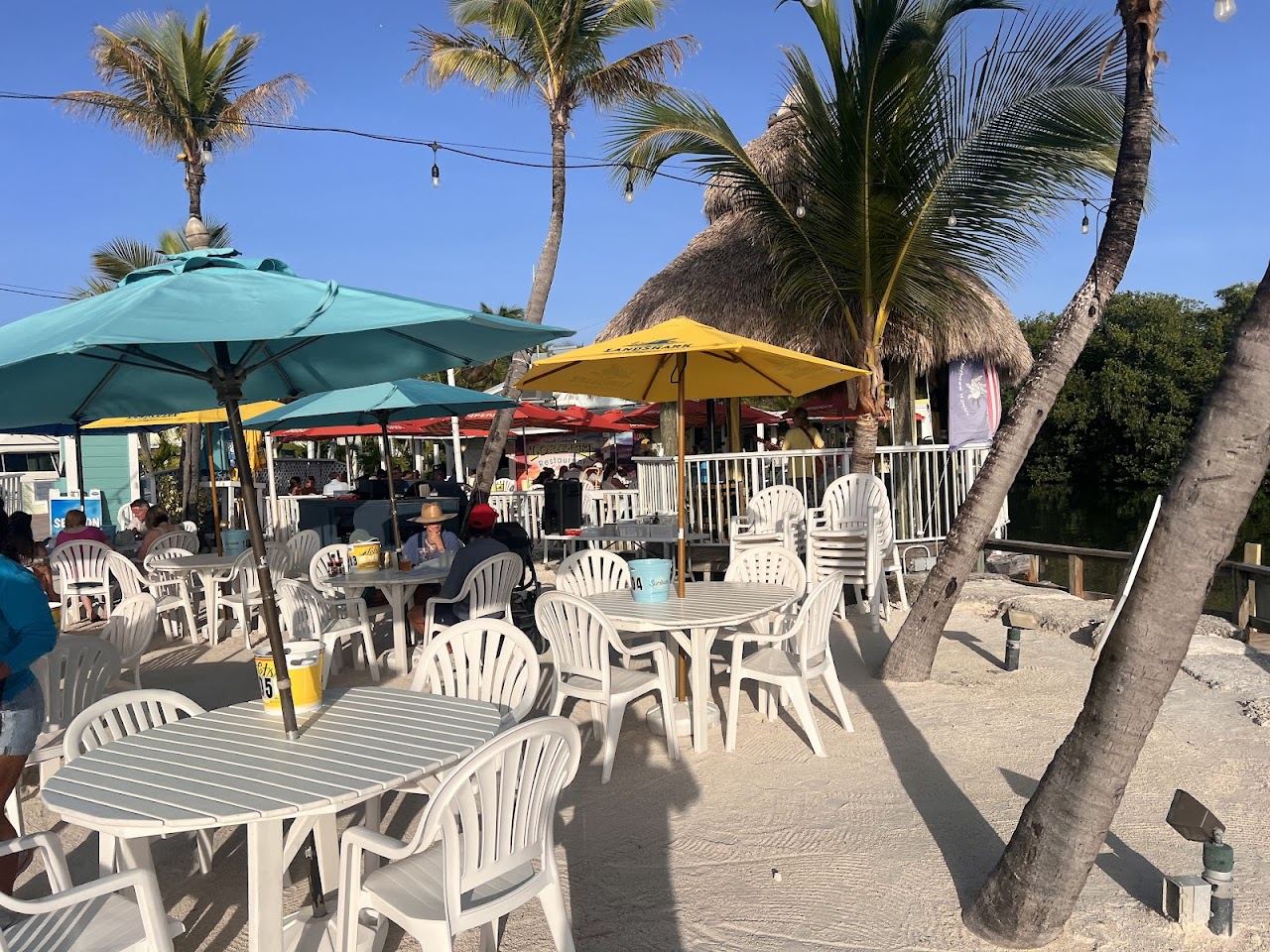 Open air tables and tiki thatch at Lorelei Restaurant and Cabana Bar on Florida Bay in Islamorada