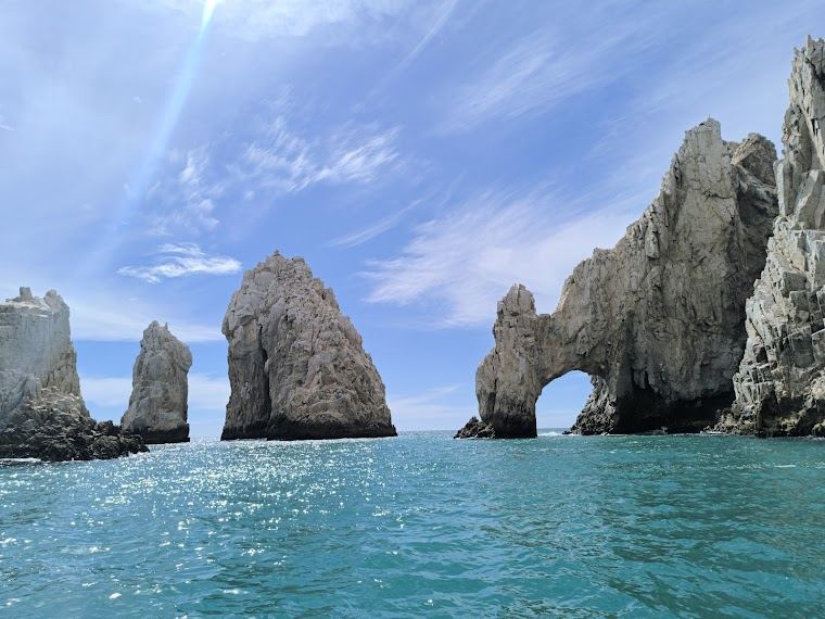 The calm Sea of Cortez cove and rock formations at Lovers Beach in Cabo San Lucas
