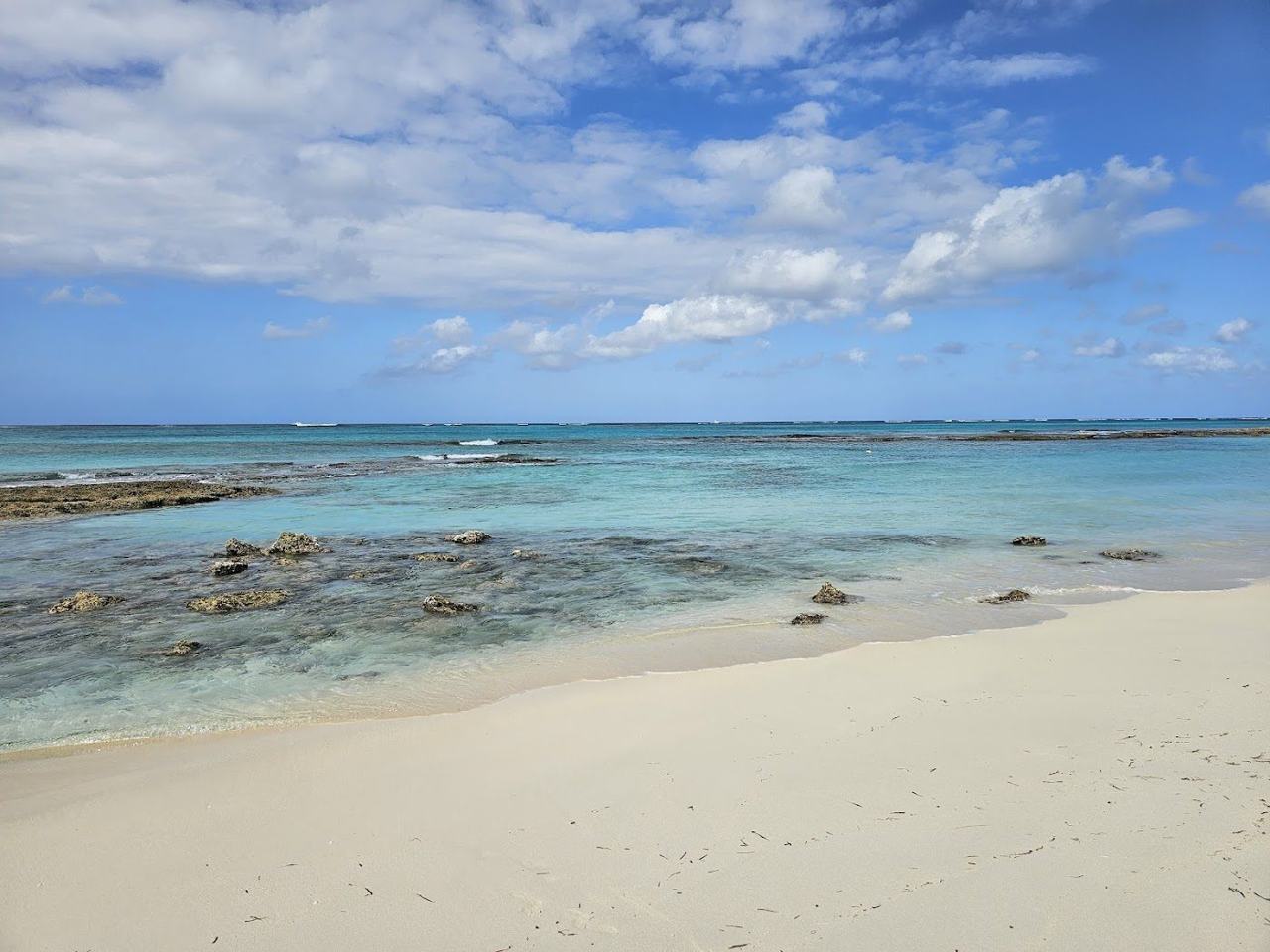 Calm shallow turquoise water over reef at Love Beach western New Providence Nassau Bahamas