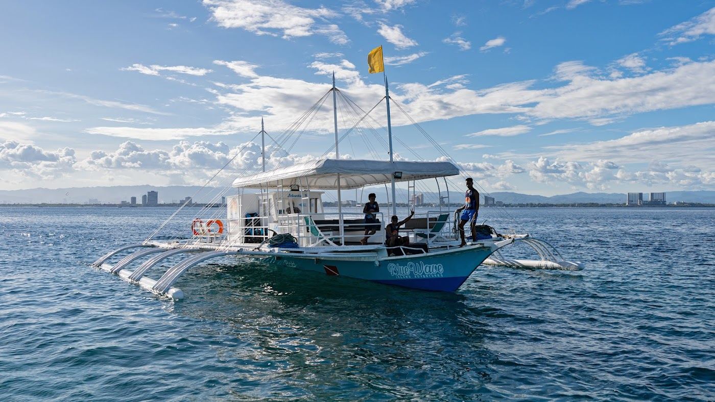 Calm protected shallows and clear water off Mactan Island on a still morning in Cebu Philippines