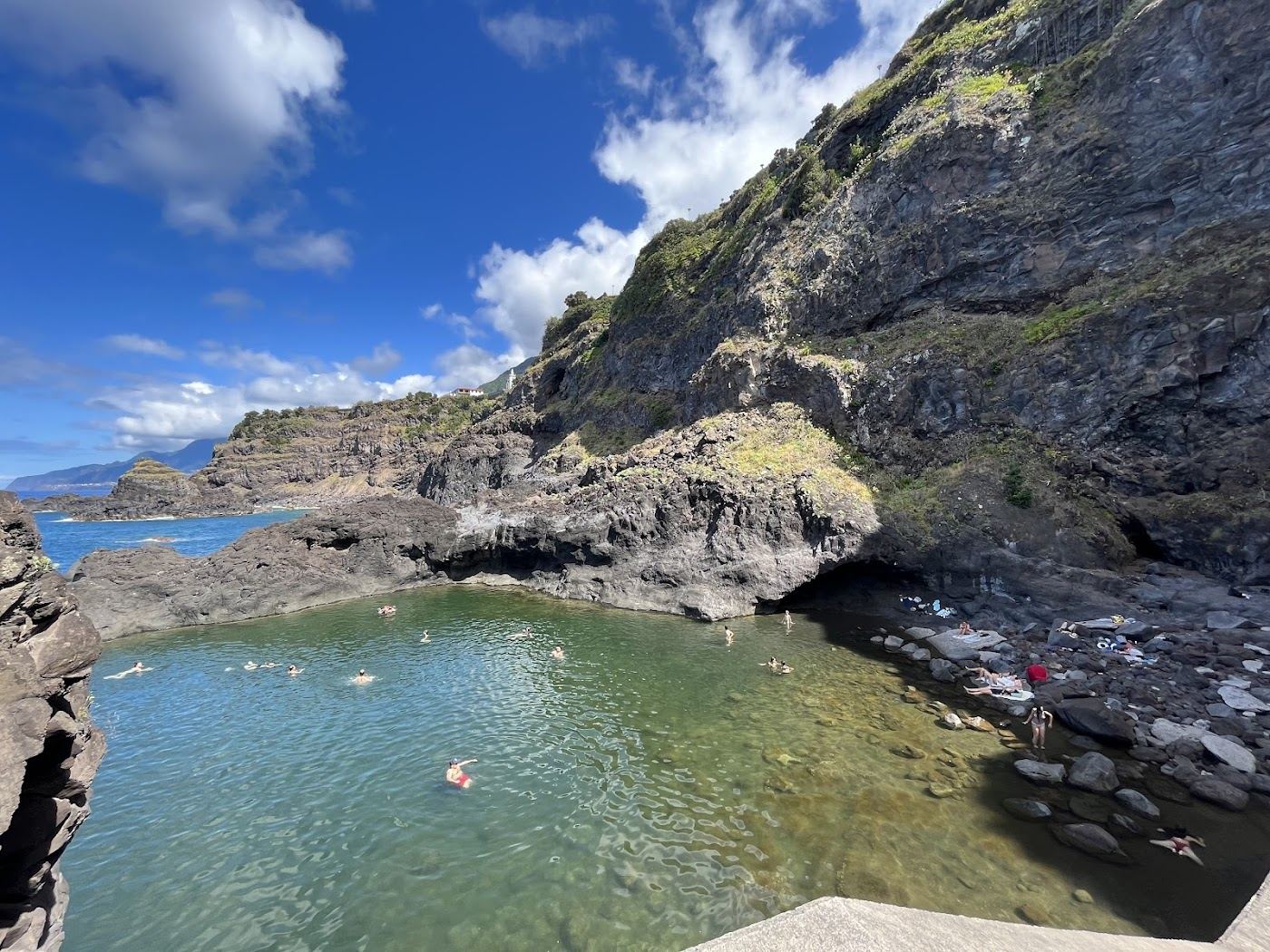Clear volcanic rock pools filled with Atlantic water at Seixal on the north coast of Madeira