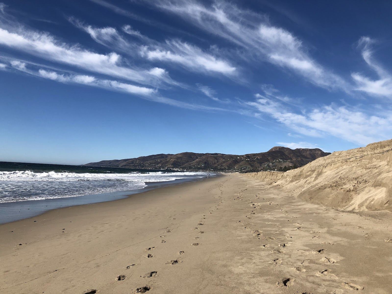 Wide public sand and Pacific surf at Zuma Beach in Malibu, California
