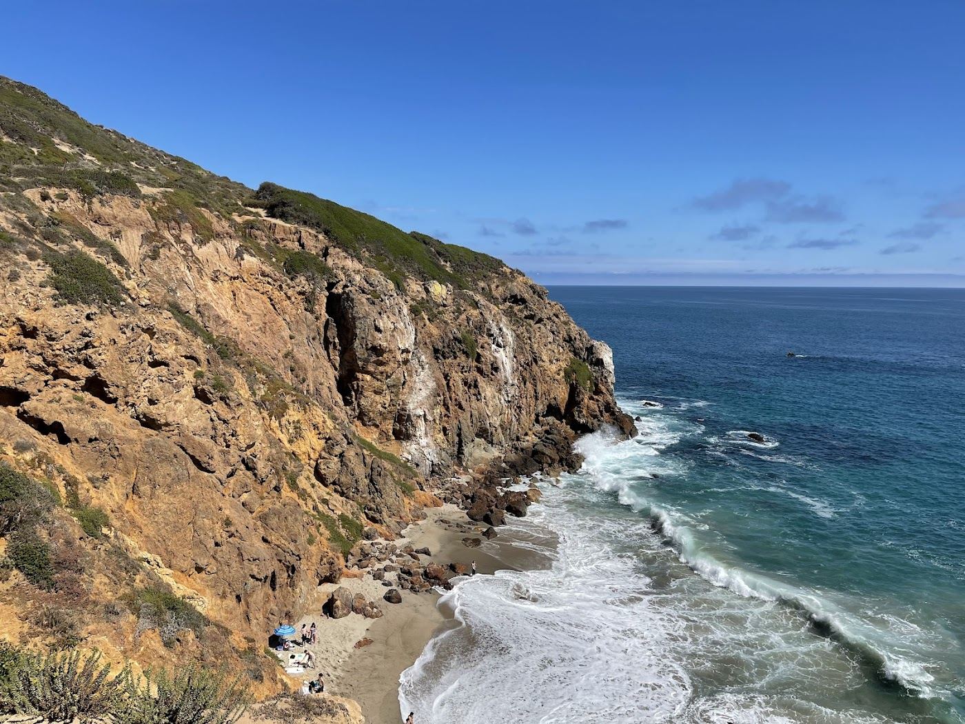 Free sand, tide pools and open surf where the only real cost is the parking.