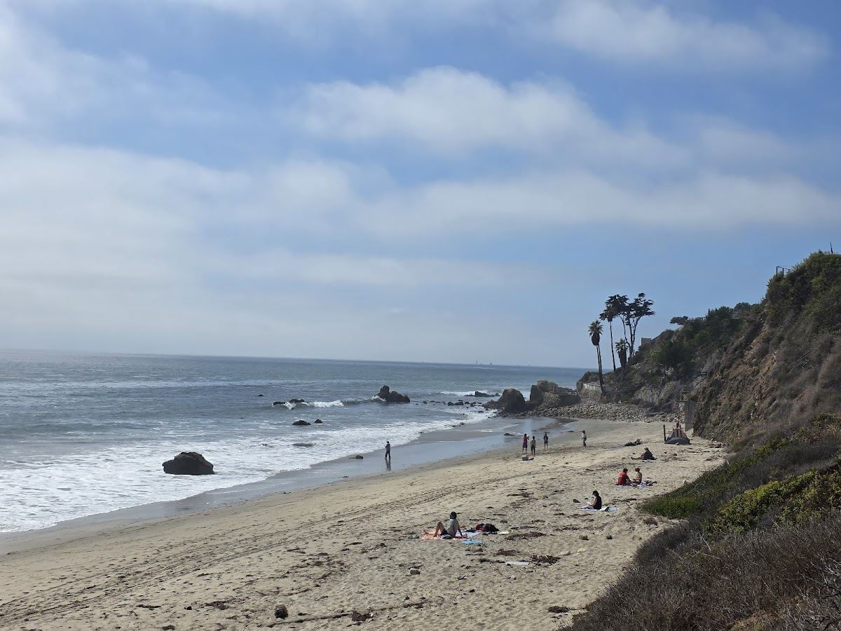 The quiet pocket cove of El Pescador Beach below the bluff in Malibu
