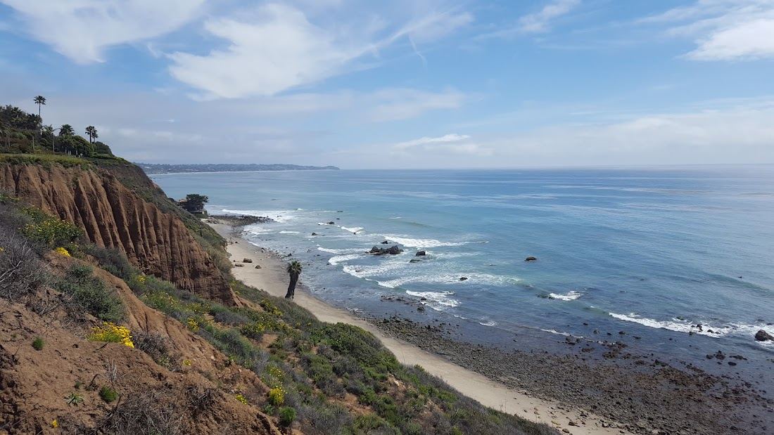 Rocks and sand at La Piedra Beach in the Robert Meyer trio in Malibu