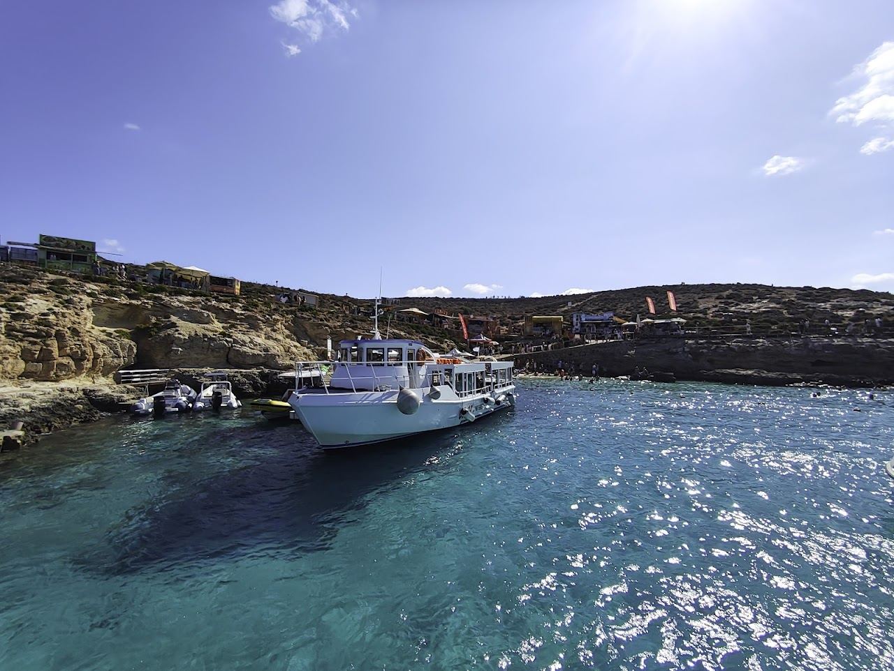 The luminous turquoise water of the Blue Lagoon between Comino and Cominotto in Malta