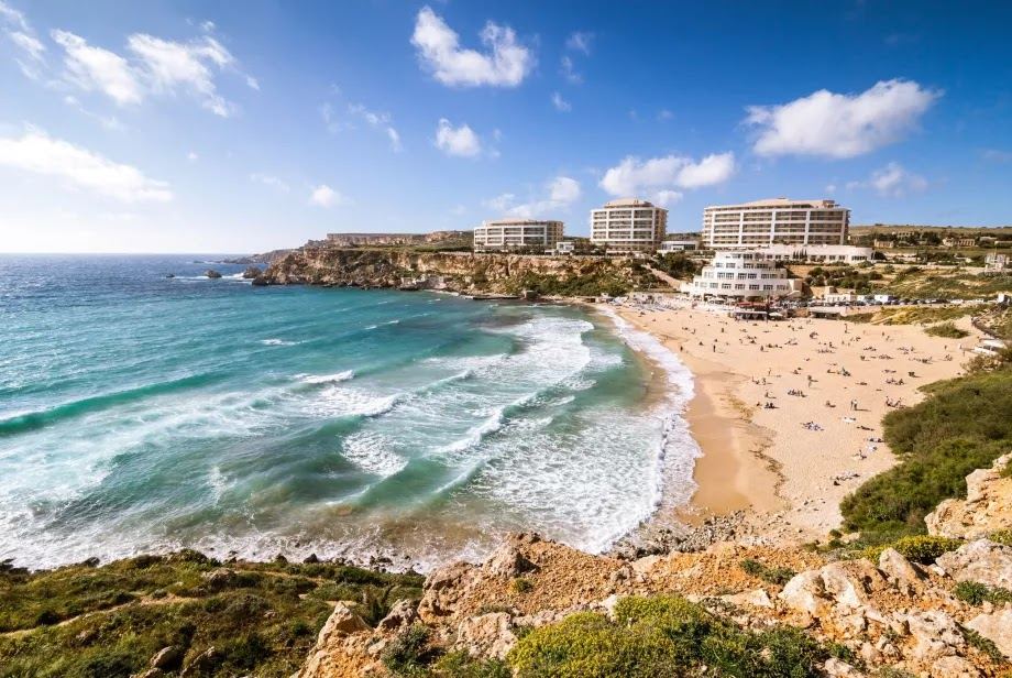 Golden sand and clear water at Golden Bay on the northwest coast of Malta