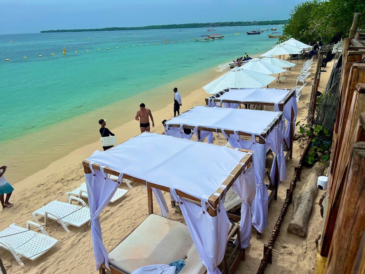 Sun loungers and umbrellas at an organised beach club on Playa Blanca, Isla Baru