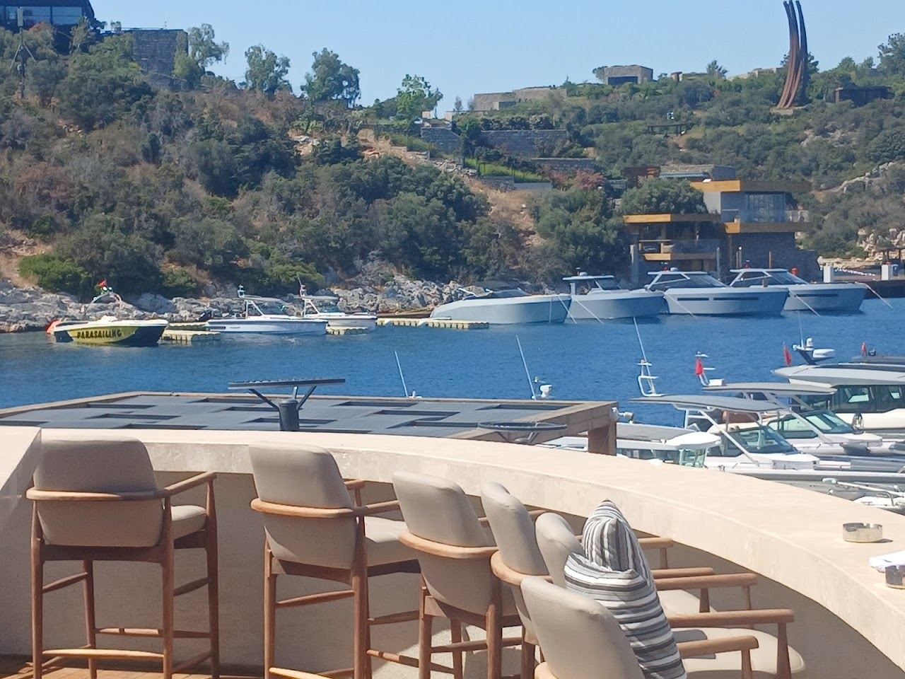 Loungers and cabanas on the soft sand of Cennet Koyu at the Mandarin Oriental Bodrum beach club