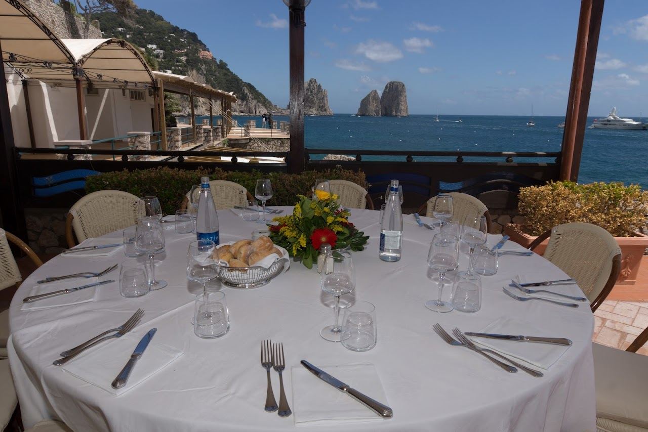Saltwater pool and sun terrace at La Canzone del Mare lido above Marina Piccola in Capri