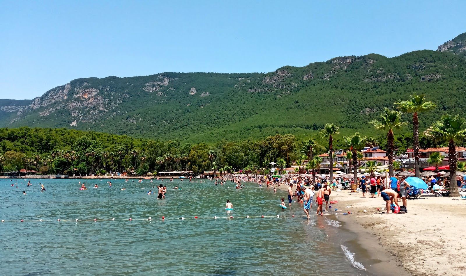 Calm blue water and a backdrop of green hills at Akyaka on the Gokova gulf