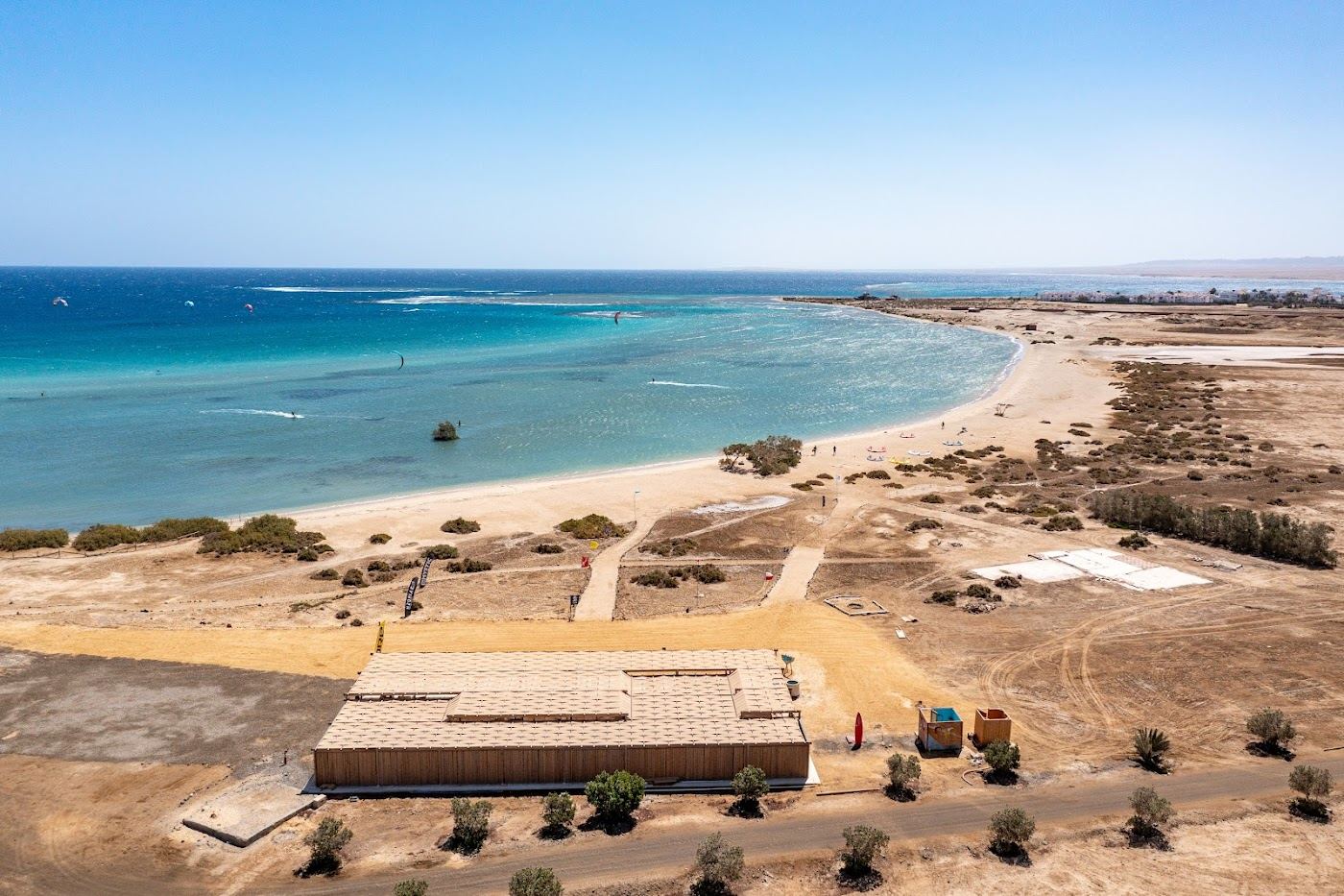 A kitesurfer riding the flat shallow turquoise lagoon at Wadi Lahami in the Deep South near Marsa Alam