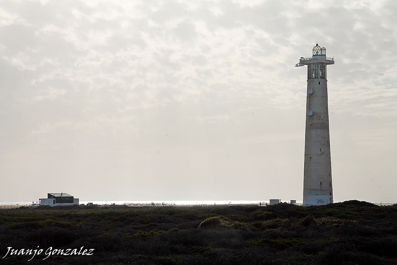 Wild open golden beach and protected salt marsh near the lighthouse at Playa del Matorral in southern Fuerteventura