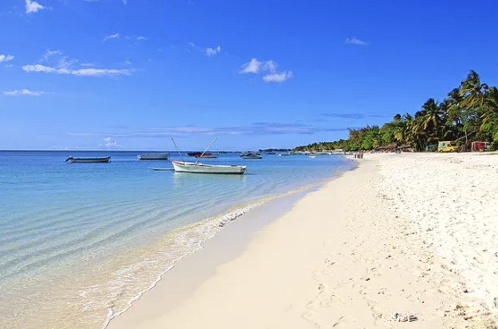Flat turquoise lagoon and pale sand at Trou aux Biches in Mauritius