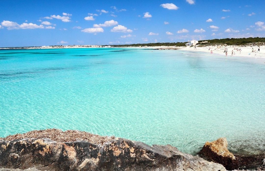 Unspoiled white sand and shallow turquoise water along Es Trenc in Mallorca
