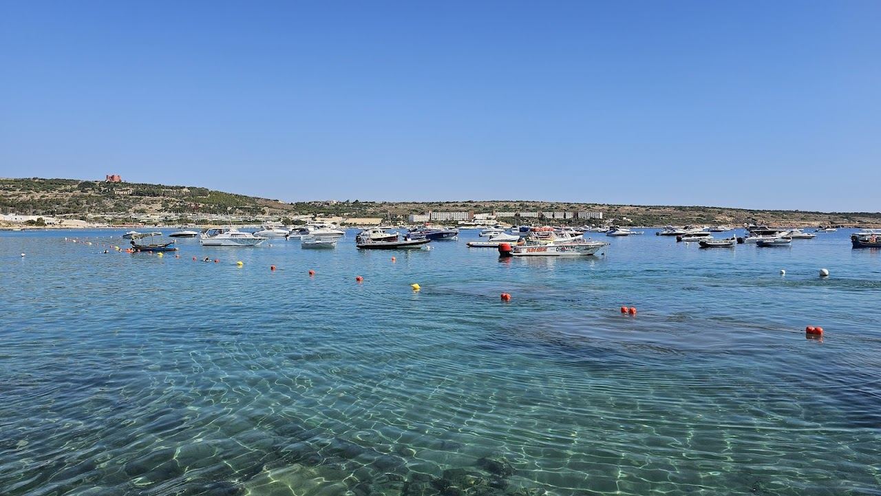 The long shallow sandy sweep of Mellieha Bay, also known as Ghadira Bay, in northern Malta