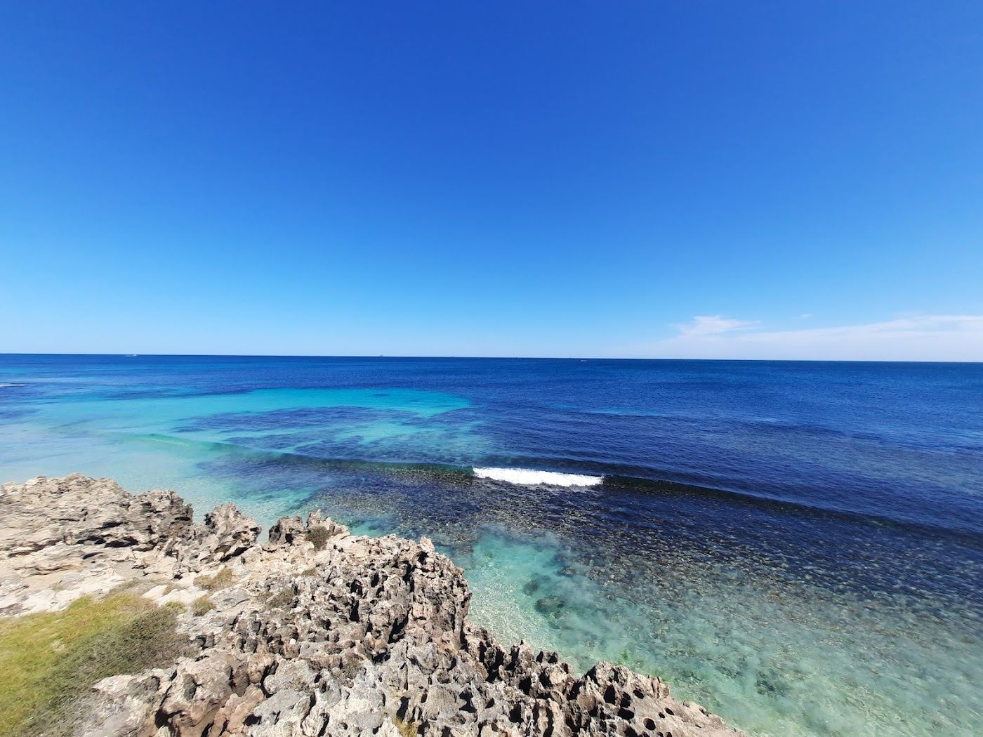 The clear sheltered reef lagoon of Mettams Pool at North Beach in Perth, Western Australia, calm over pale sand