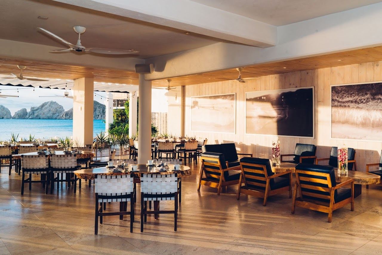 Stylish loungers at Sur Beach House on Medano Beach in Cabo