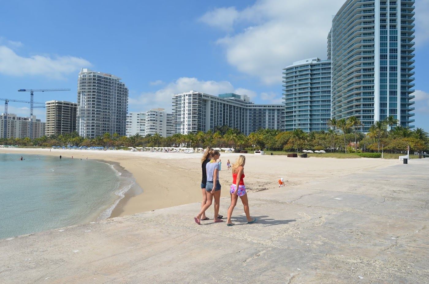 Quiet soft sand and clear water at Bal Harbour Beach in Miami at golden light