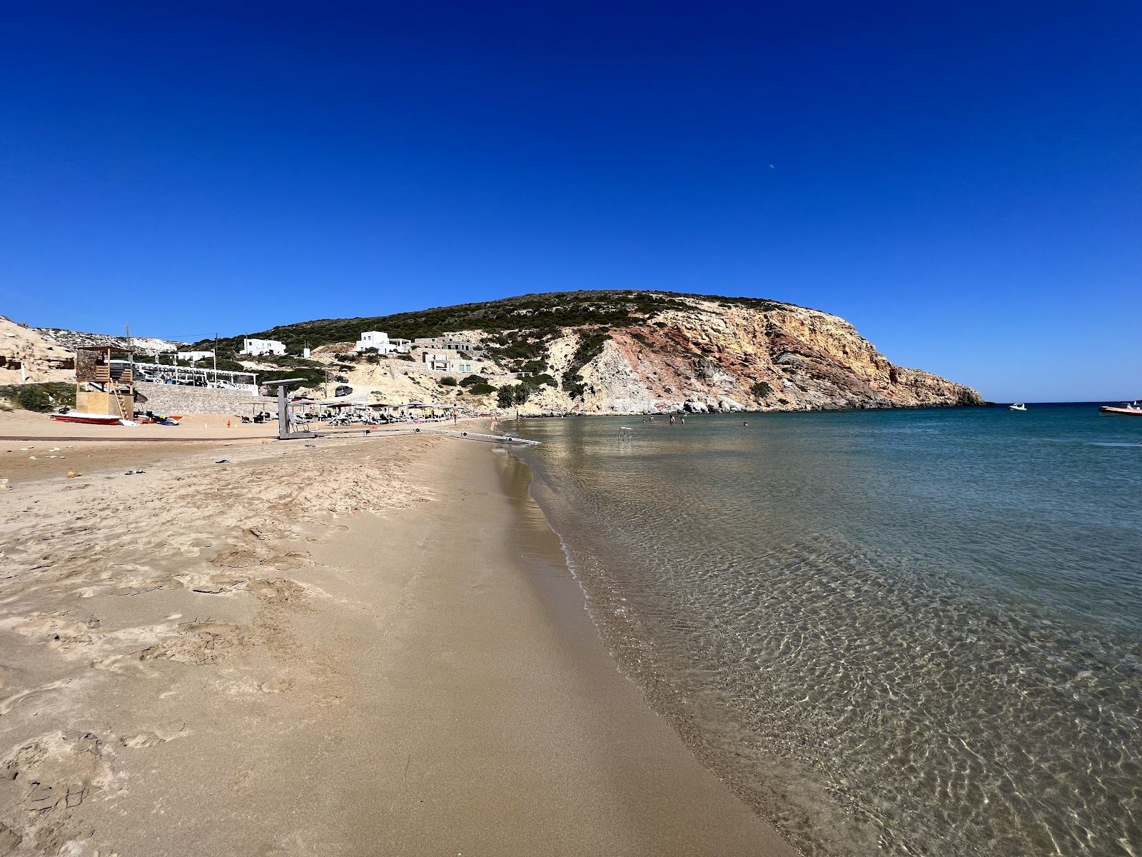 Calm shallow water and golden sand at a family friendly Milos beach in the Cyclades