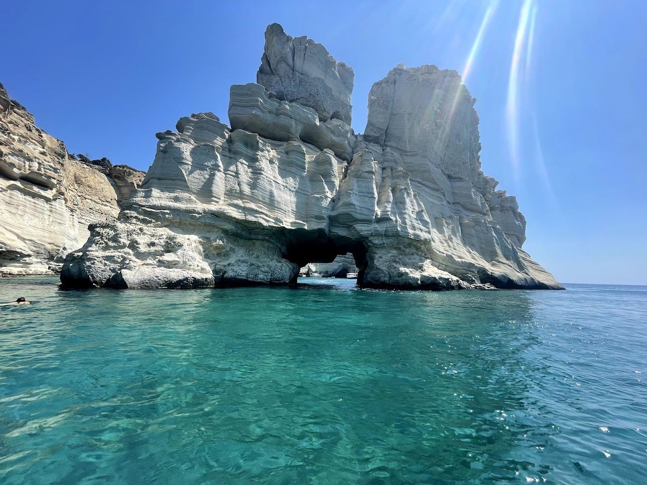 Clear turquoise water against the white sea cliffs and caves at Kleftiko on the south coast of Milos