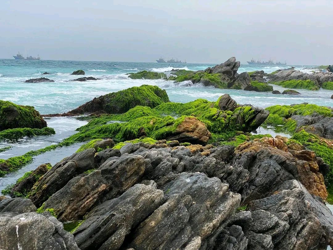 The fishing shore and weathered old town buildings at Mirbat east of Salalah in Oman