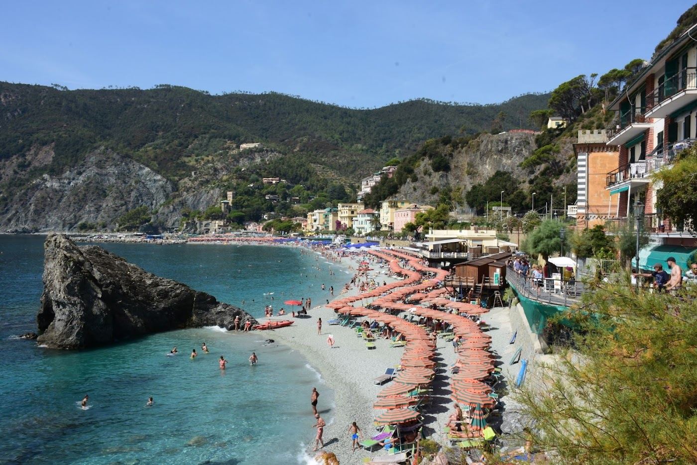 The old town beach and harbour of Monterosso al Mare below the terraced Liguria hills