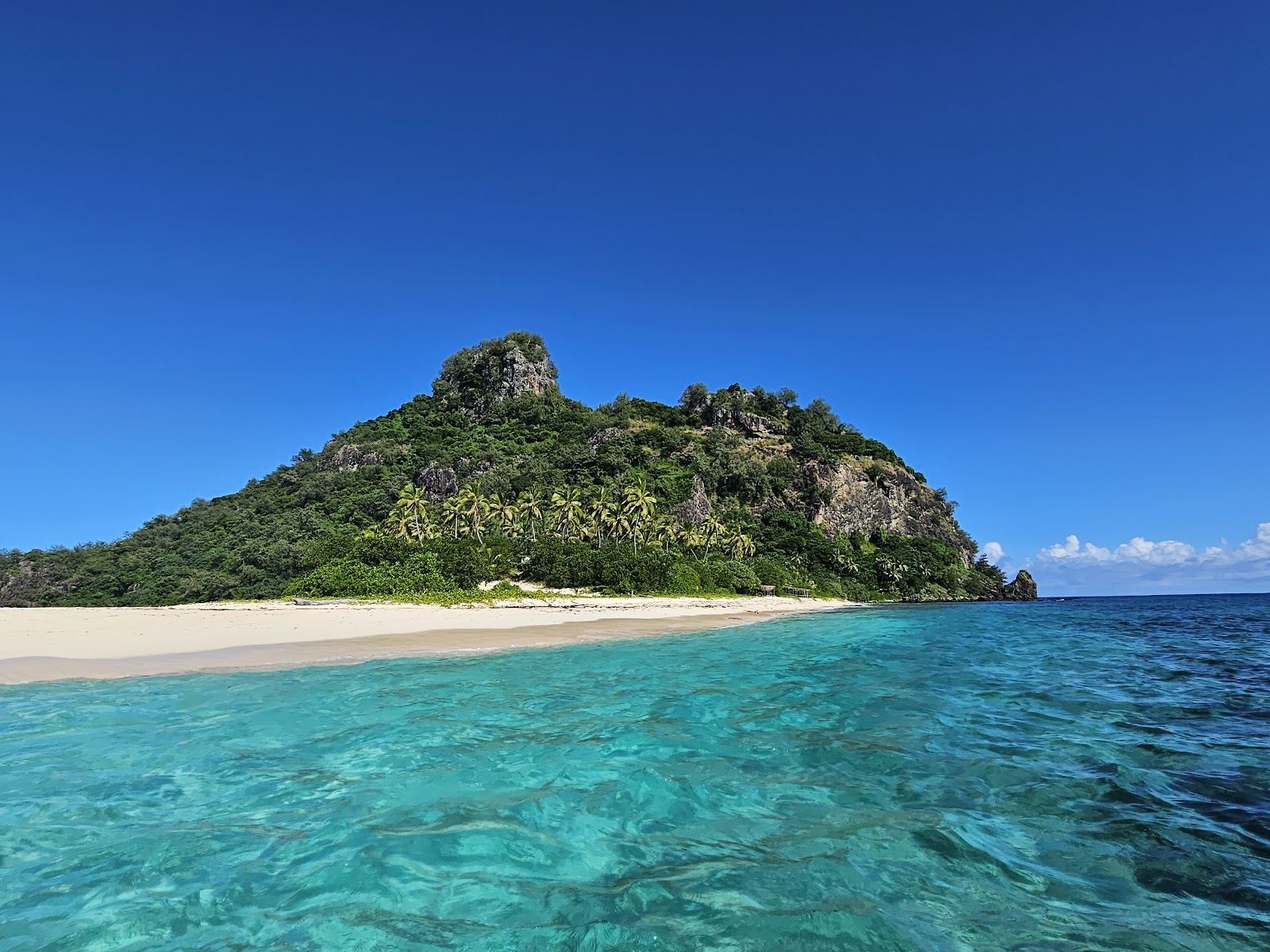 White sand and reef fringed water at Monuriki, the uninhabited Cast Away island in the Mamanuca group of Fiji